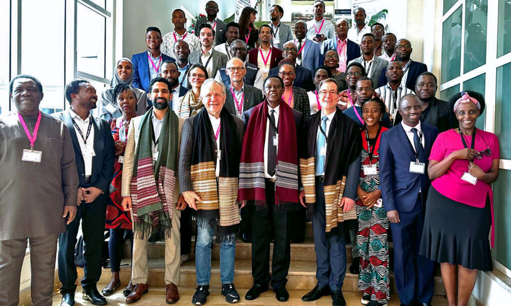 Group photo of the participants of the first annual consortium meeting 2023 of STAIRS standing in a hall way.