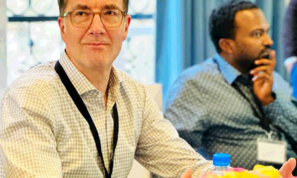 Close up of Prof. Torsten Feldt sitting at a conference table.